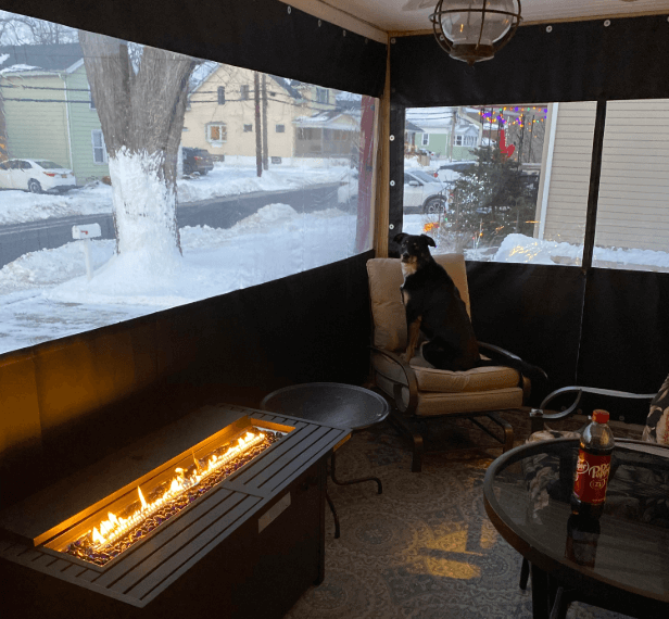 Tarped patio area with fireplace grate