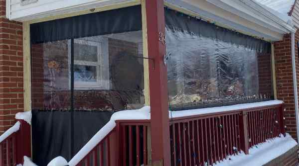 Tarp-enclosed porch area