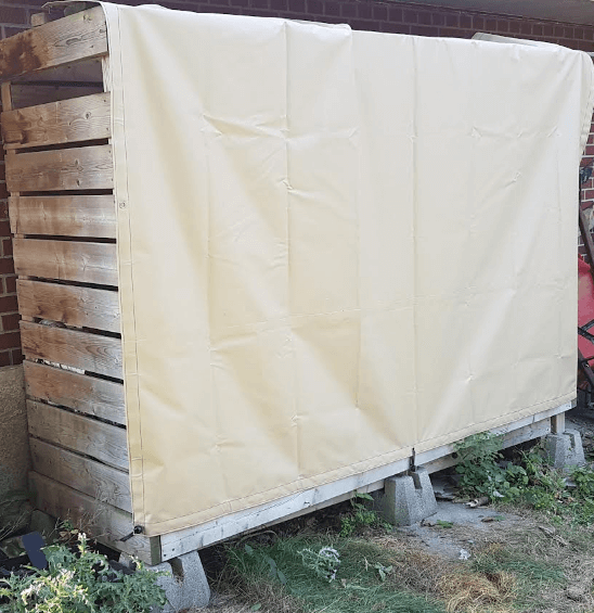 Wood rack with vinyl tarp cover